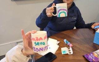 Mother and daughter painting mugs at Ellyn Crossing Teen Hangout with DuCAP on January 31st, 2024.