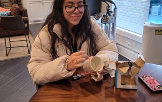 Daughter painting mug at Ellyn Crossing Teen Hangout with DuCAP on January 31st, 2024.